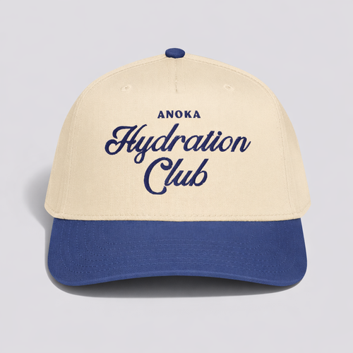 Beige and blue cap with 'Anoka Hydration Club' text on a light gray background